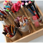 Transportable art supplies caddy made from reused tin cans and jam jars