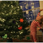 Dancing around the Christmas tree in her new candy stripe pajamas Dancing around the Christmas tree in her new candy stripe pajamas