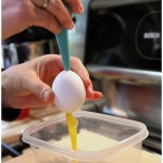 Blowing out Easter eggs with a nasal aspirator